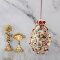 Load image into Gallery viewer, Golden Crown Easter Egg Beaded Ornament embellished with flowers, gold leaves, floral trim, and crystal beads. Side2. (White).