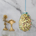 Load image into Gallery viewer, Golden Crown Easter Egg Beaded Ornament embellished with flowers, gold leaves, floral trim, and crystal beads. Back. (Light Yellow).