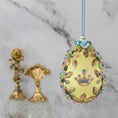 Load image into Gallery viewer, Golden Crown Easter Egg Beaded Ornament embellished with flowers, gold leaves, floral trim, and crystal beads. Front. (Light Yellow).