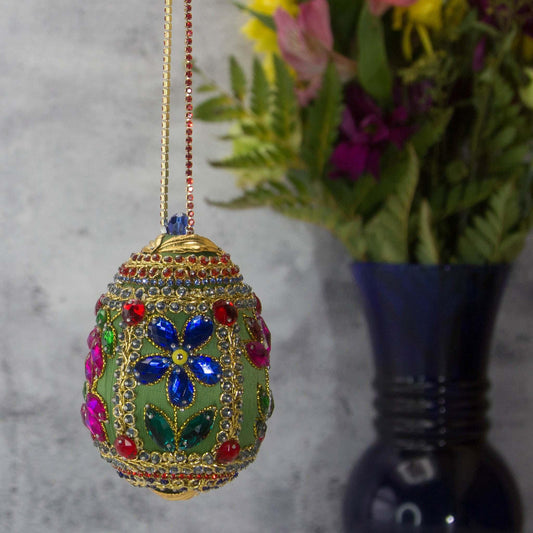 Handmade Easter Egg Beaded Ornament embellished with flowers, leaves, gold floral trim, and crystal beads. Side. (Olive).