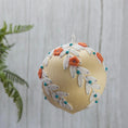 Load image into Gallery viewer, Christmas or Easter Beaded Ornament Ball embellished with flowers, trim, and beads. Handmade. (Papaya Whip).