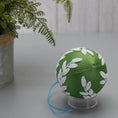 Load image into Gallery viewer, Christmas or Easter Beaded Ornament Ball embellished with flowers, trim, and beads. Handmade. Bottom Detail. (Olive).