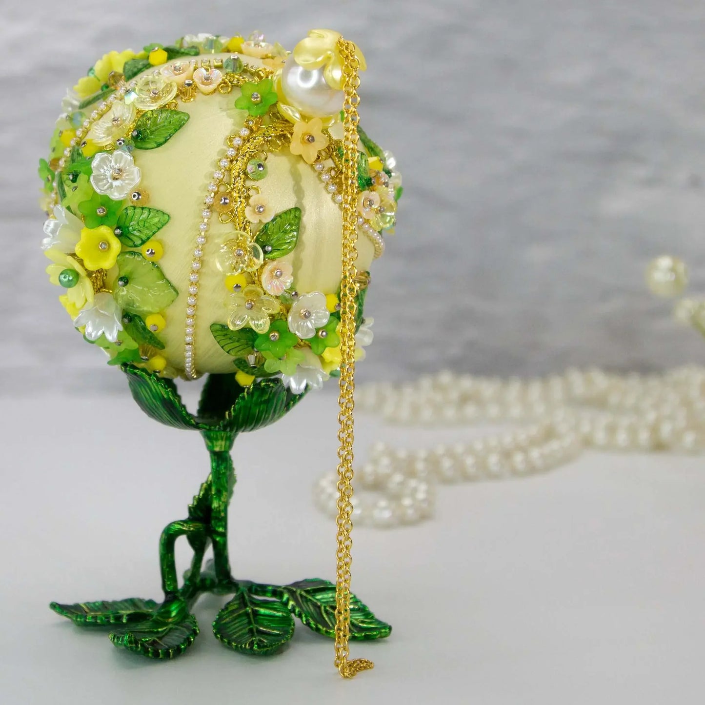 Christmas or Easter Beaded Ornament Ball embellished with acrylic flowers, leaves, and crystal beads. Handmade. Top detail. (Light Yellow).