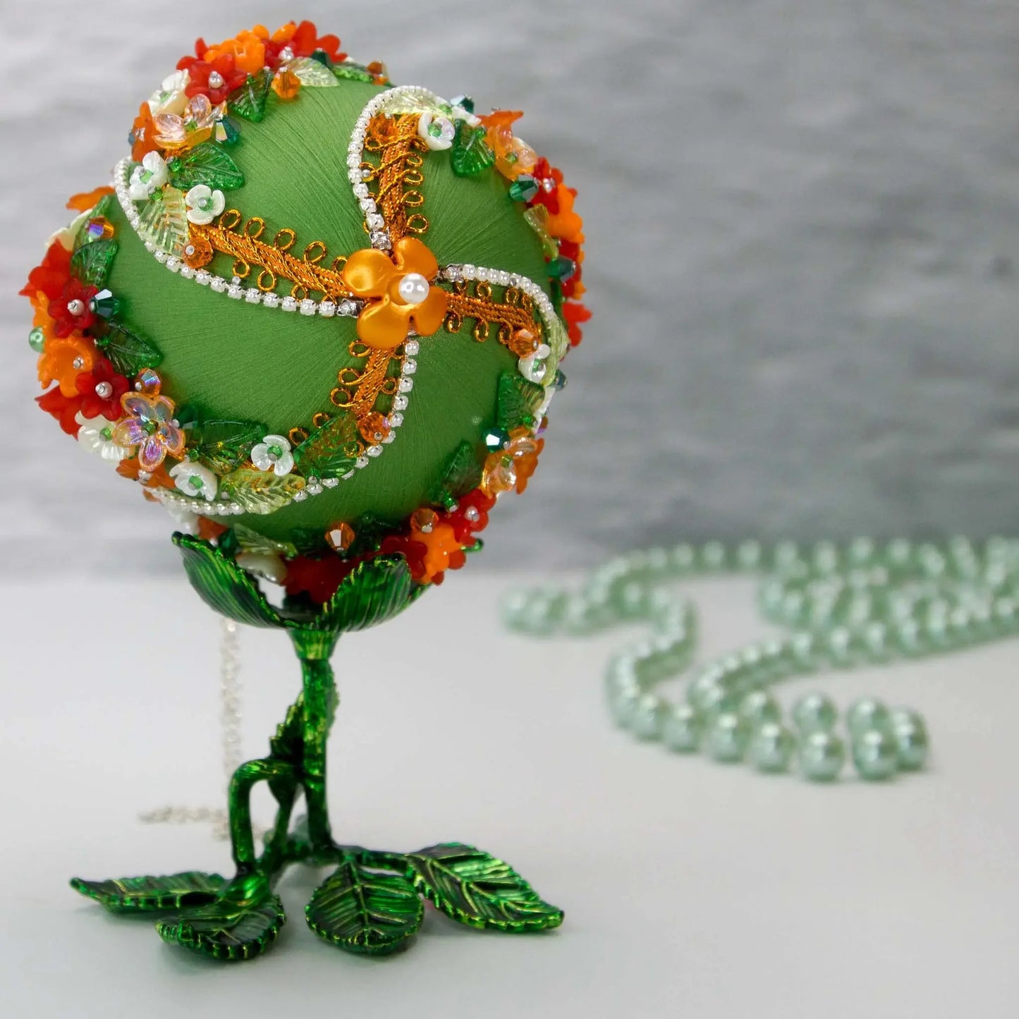 Christmas or Easter Beaded Ornament Ball embellished with flowers, trim, and beads. Handmade. Top detail. (Olive).