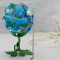 Load image into Gallery viewer, Christmas or Easter Beaded Ornament Ball embellished with acrylic flowers, leaves, and crystal beads. Handmade. Top detail. (Sky Blue).