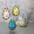 Load image into Gallery viewer, Collection of Handmade Vintage inspired Satin Easter Egg Ornaments embellished with gold crowns, flower trim, and beads.