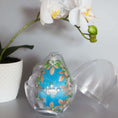 Load image into Gallery viewer, Handmade Easter Egg Ornament embellished with gold crown, beads, alloy leaf charms in an egg-shaped storage container. (Sky Blue).