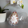 Load image into Gallery viewer, Handmade Easter Egg Ornament embellished with gold crown, beads, alloy leaf charms in an egg-shaped storage container. (White).