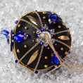 Load image into Gallery viewer, Close-up of Phoenix Christmas Beaded Handmade Satin Ornament, embellished with large gold cameos, rhinestones, gold alloy accents, and copper cobweb lace. (Black)