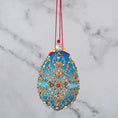 Load image into Gallery viewer, This Faberge Inspired Easter Egg Ornament kit is a true gem from Whim5seasons. Striking blue color contrasted with red and gold accents. (Sky Blue)