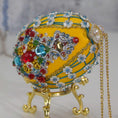 Load image into Gallery viewer, Close-up of Easter Egg by Whim5seasons Ornament embellished with crystals, beads, and metallic trim . Bottom detail. (Dark Orange).