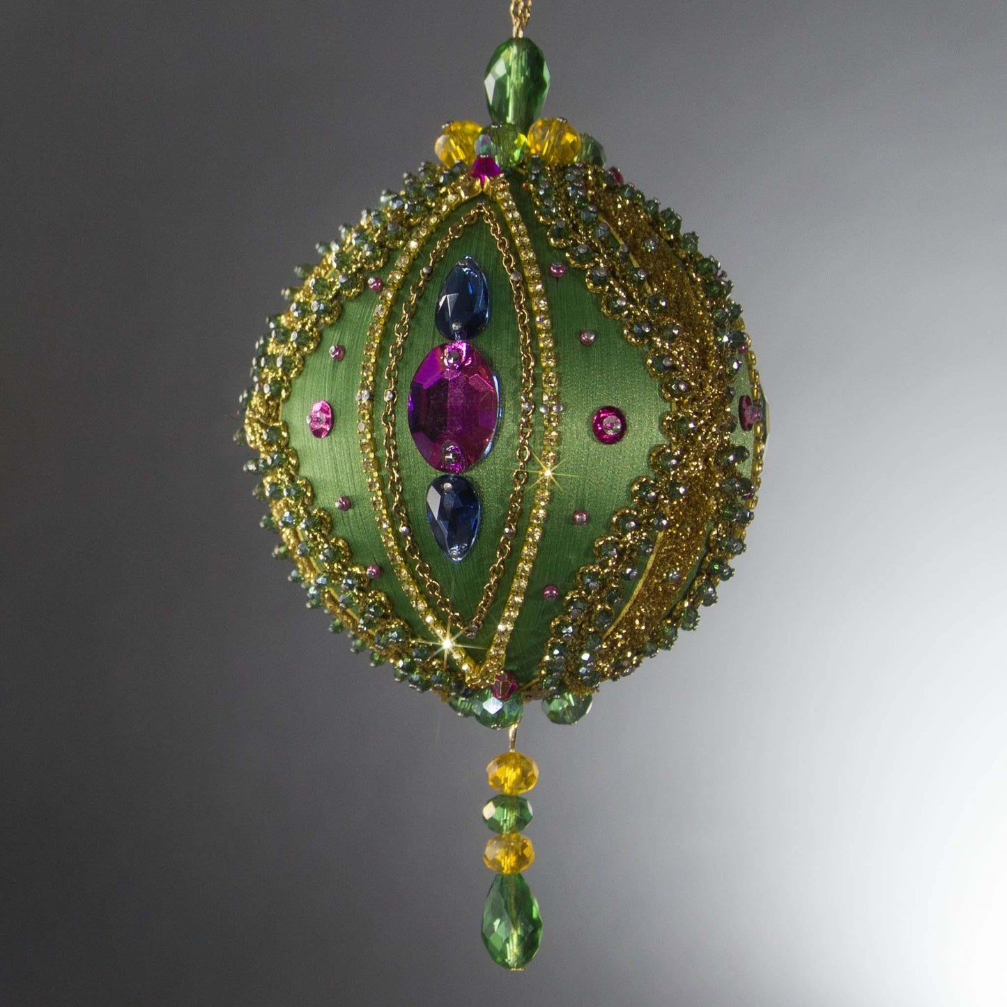 Christmas Beaded Ornament Ball embellished with large glass color-shifting rhinestones, gold braided trim, and crystal beads. (Olive).