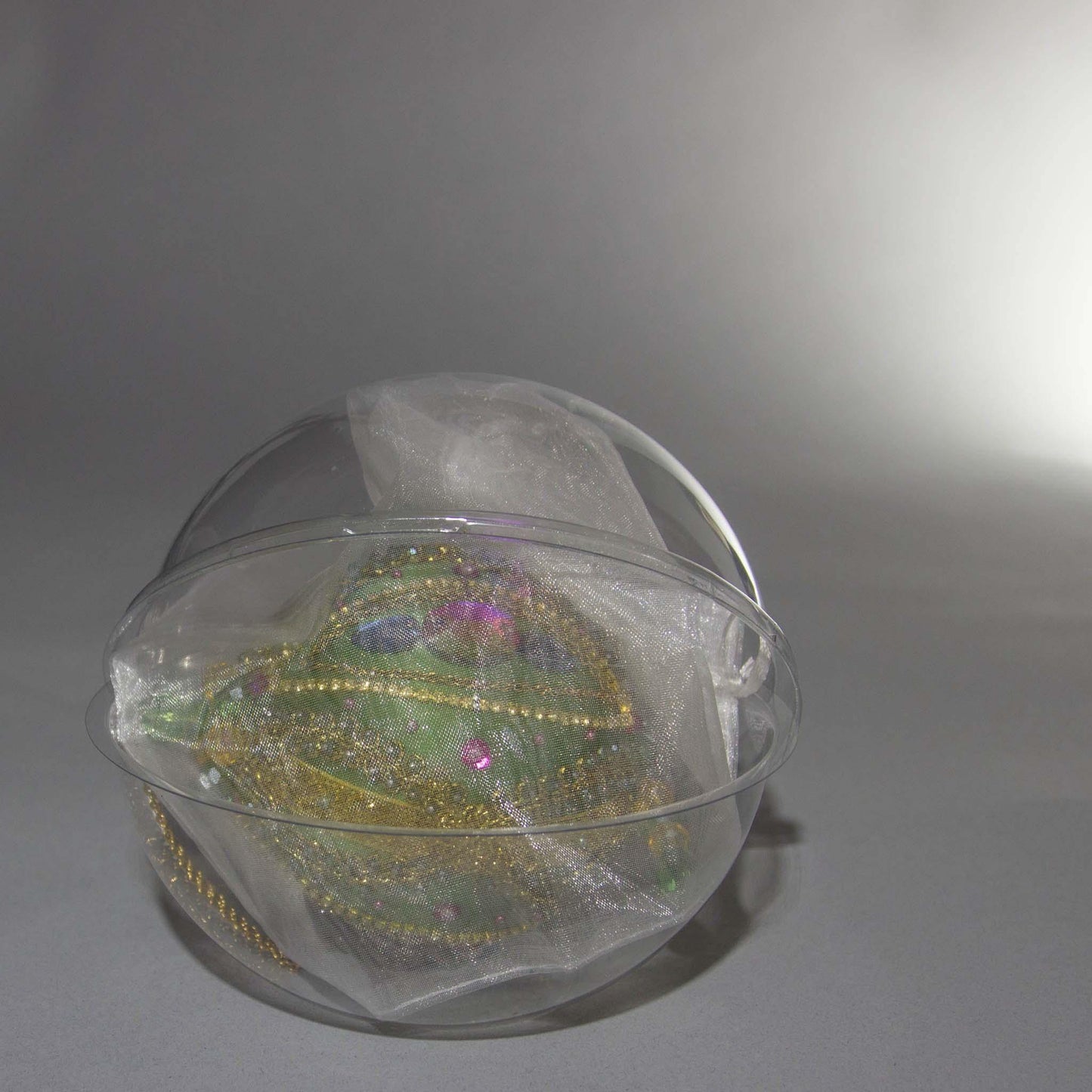 Packaging for Christmas Beaded Ornament Ball embellished with glass rhinestones, gold braided trim, and crystal beads. (Olive).
