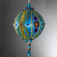 Load image into Gallery viewer, Christmas Beaded Ornament Kit Ball embellished with glass rhinestones, gold braided trim, and crystal beads. Side view. (Sky Blue).