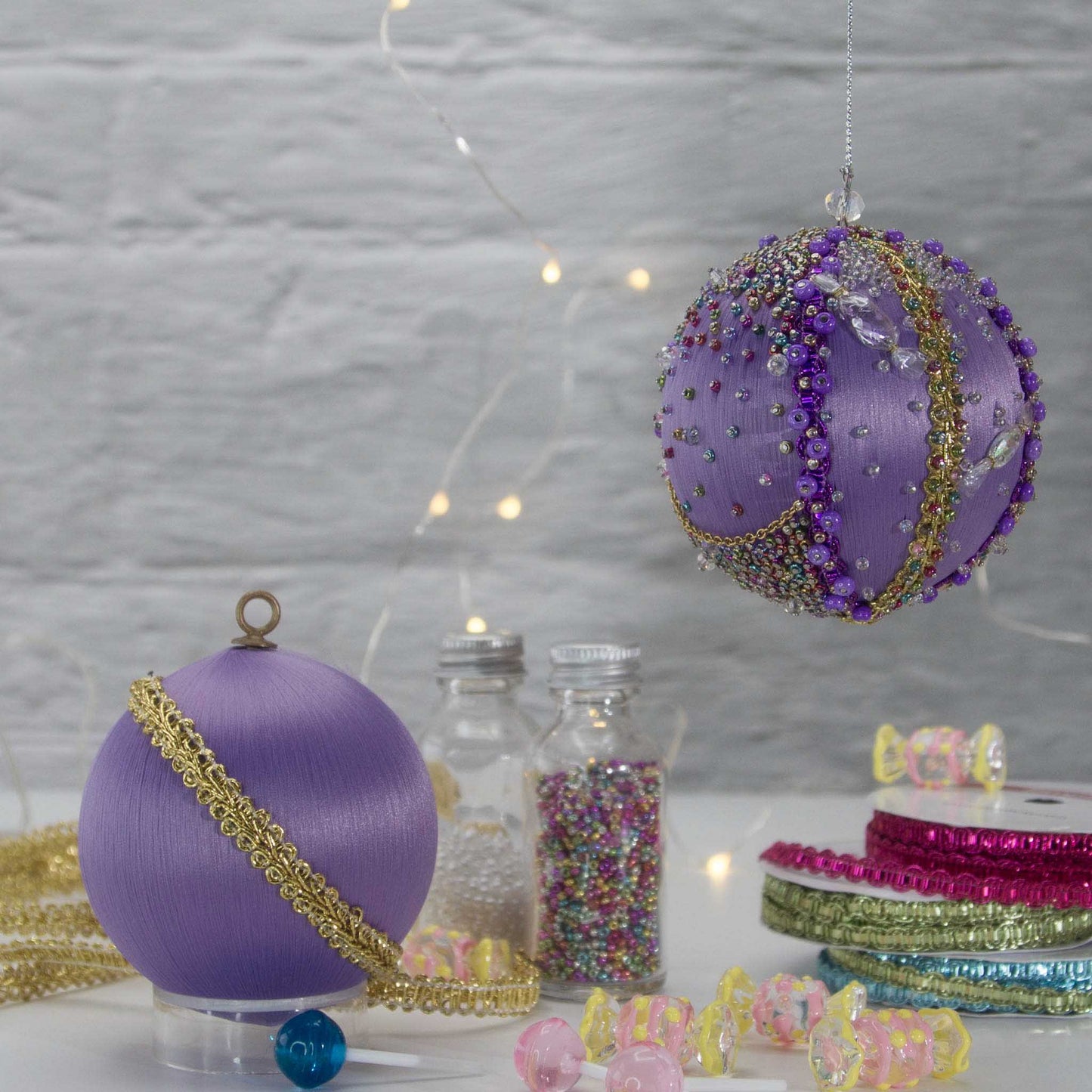 A close-up of Handmade Christmas Ornament Candy by Whim5seasons - thousand of Miyuki seed beads, meticulously applied one by one by hand. (Medium Purple)