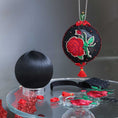 Load image into Gallery viewer, Finished ornament and a white satin ball with decorative items, embroide3red red roses patches on a dark background. (Black)