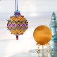 Load image into Gallery viewer, Two push pin satin ornaments of mustard color. One is handmade and finished Christmas ornament, and the other is on a gold stand .Completed push pin ornament features purple rhinestones, blue beads, and gold cording. (Gold)