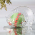 Load image into Gallery viewer, Completed Push Pin Ornament "Leaves Are Falling" features an olive colored satin foam core and comes in a gauze bag and a clear plastic storage container, pictured on top of the reflective surface. (Olive)