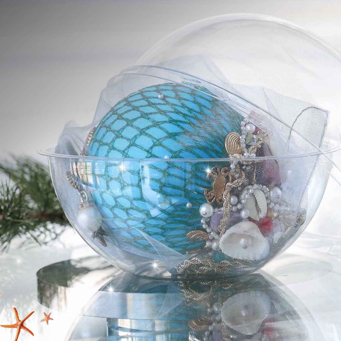 Handmade sequin & beaded teal-colored satin ornament inside a round plastic storage container with holiday greenery by Whim5seasons.