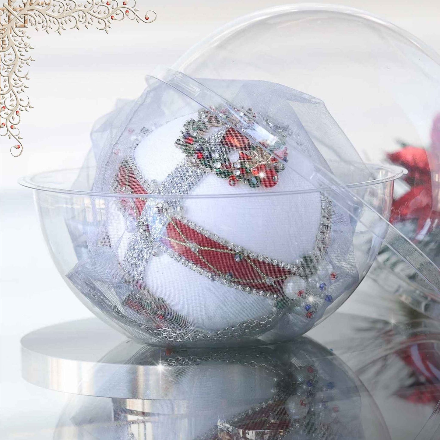 Handmade satin beaded white Christmas ornament embellished with beads and trims in front of gray background and holiday greenery in a clear plastic container by Whim5seasons.