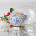 Load image into Gallery viewer, Decorative Handmade Christmas blue satin ball with a snowflake design inside a round clear storage container, surrounded by festive elements on a light background. (Blue)
