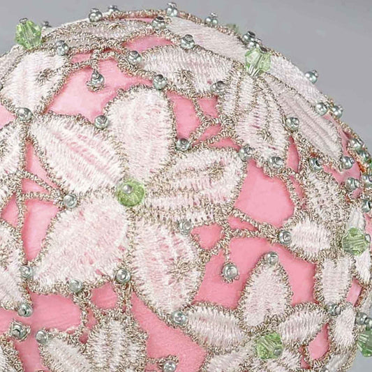 Close-up of a decorative pink push pin satin ball showing small beads pinned with dressmaker pins by Whim5seasons.