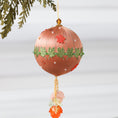 Load image into Gallery viewer, A Handmade Push Pin Ornament in brown color featuring a green maple ribbon trim pinned to a satin foam core with dressmaker pins, and some acrylic maple leaf charms, and clear seed beads. (RosyBrown)