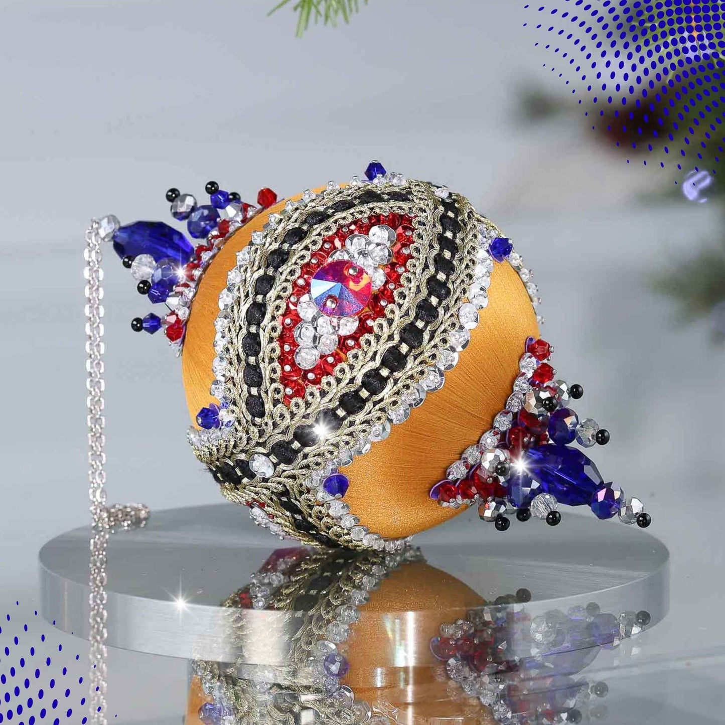 Handmade sequin & beaded push pin ornament featuring an eye design on a reflective surface with light gray background and holiday greenery by Whim5seasons.