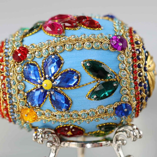 A close-up detail of a push pin Easter Egg ornament showing small glass rhinestones and seed beads pinned to a blue satin foam core by Whim5seasons.
