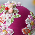 Load image into Gallery viewer, A detail of a pink satin handmade large Easter egg ornament showcasing craftsmanship with floral lace and hundreds of beads attached with pins by Whim5seasons. (Purple)