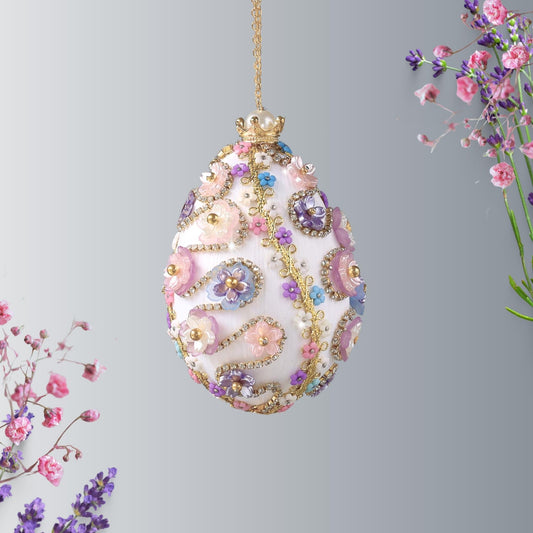 A complete handmade Easter Egg Ornament, push pin method using premium satin gold egg shaped core, bead embellishments, gold trim, and a crown charm by Whim5seasons.