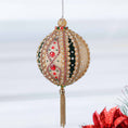 Load image into Gallery viewer, Handmade gold beaded push pin ornament featuring small pearls, red rhinestones, and a gold chain tassel, hanging on a chain in front of light gray background by Whim5seasons.