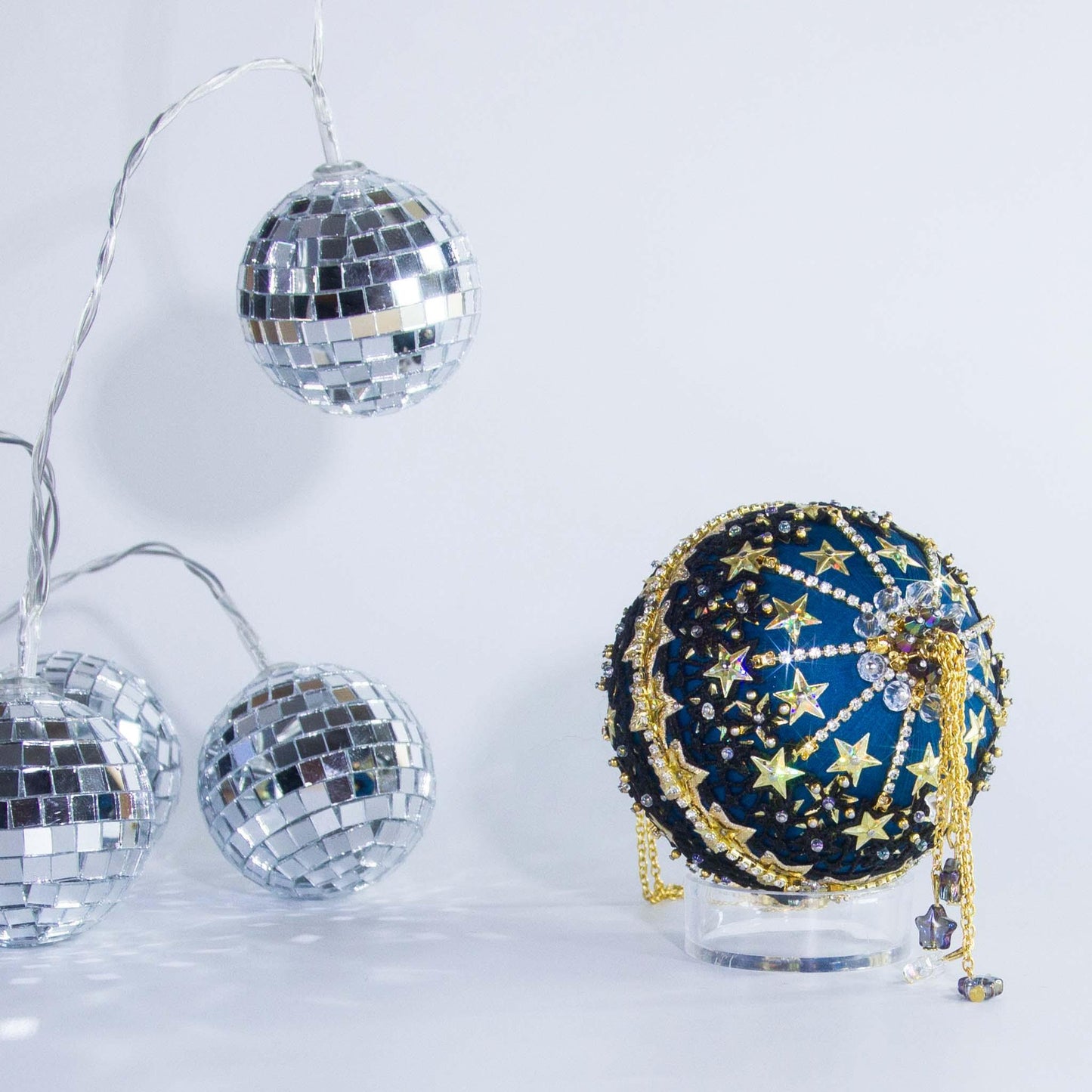 A close view of the bottom detail of New Year Star Ornament from Whim5seasons showcasing sparkling rhinestones and crystal beads. (Dark Slate Blue)