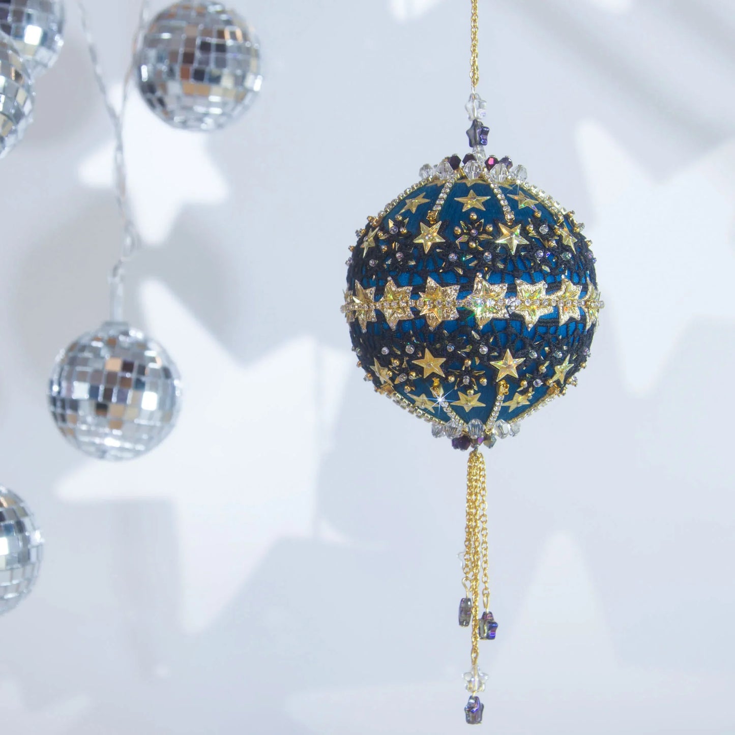 New Year Star Sequin Ornament from Whim5seasons features shiny rhinestone chains, gold star trim and sequin set on a rich fark blue satin ball. (Dark Slate Blue)