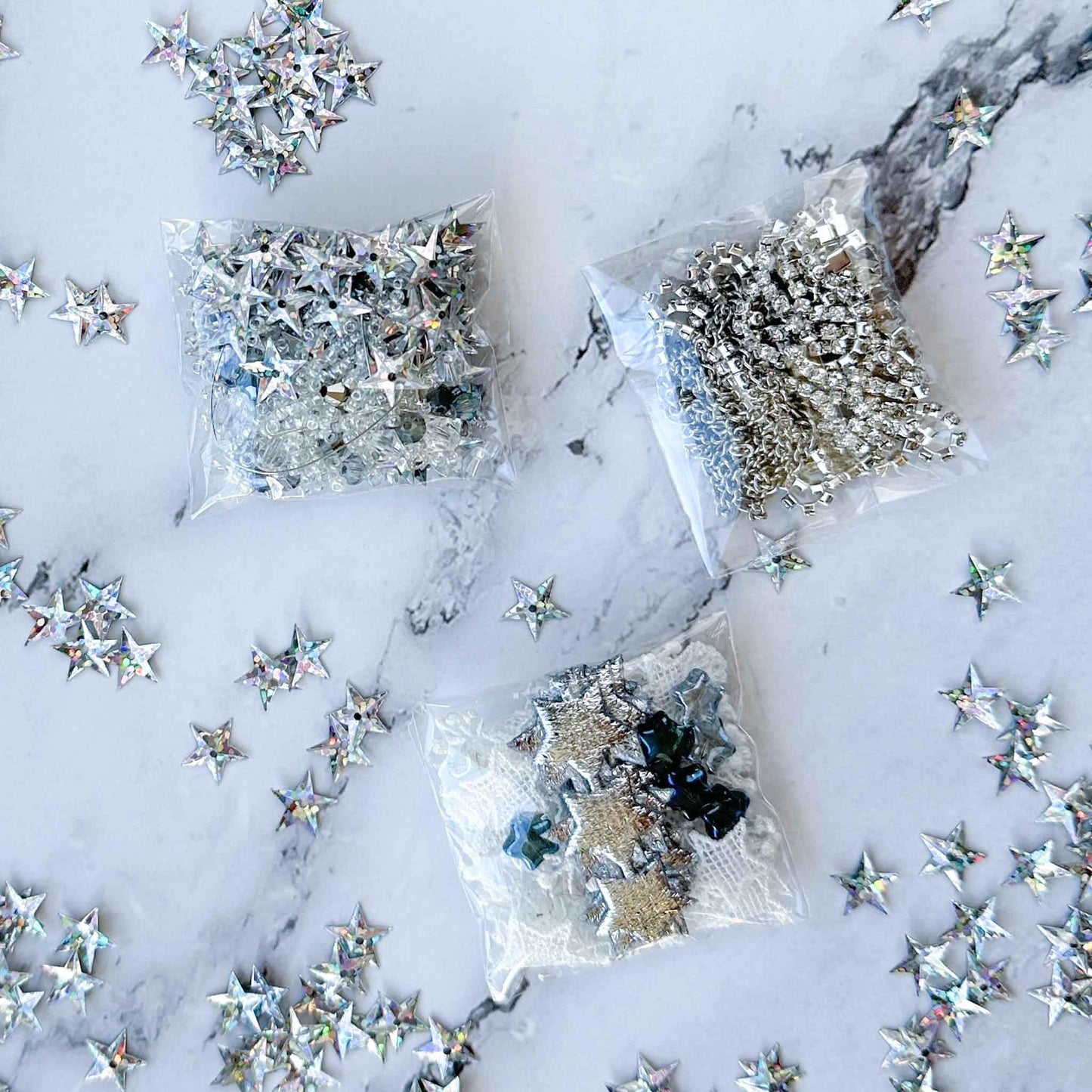 White New Year Star Ornament Kit from Whim5seasons includes: silver star trim and sequin, rhinestone chains, pins, and more - from Whim5seasons. (White)