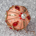 Load image into Gallery viewer, Phoenix Christmas Beaded Handmade Satin Ornament features large top pearls bead, beautifully contrasted against the peachy satin ornament. (Coral)