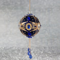 Load image into Gallery viewer, Phoenix Christmas Beaded Handmade Satin Ornament features large cameos with indigo blue rhinestones, gold alloy accents, and rose old chain. (Navy)