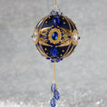 Load image into Gallery viewer, Phoenix Christmas Beaded Handmade Satin Ornament features large cameos with indigo blue rhinestones, gold alloy accents, and rose old chain. (Navy)