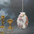 Load image into Gallery viewer, Handmade Easter Egg Satin Ornament by Whim5seasons - DIY white satin egg meticulously crafted with embroidery patches, hundreds of beads, and silver cording. (White)