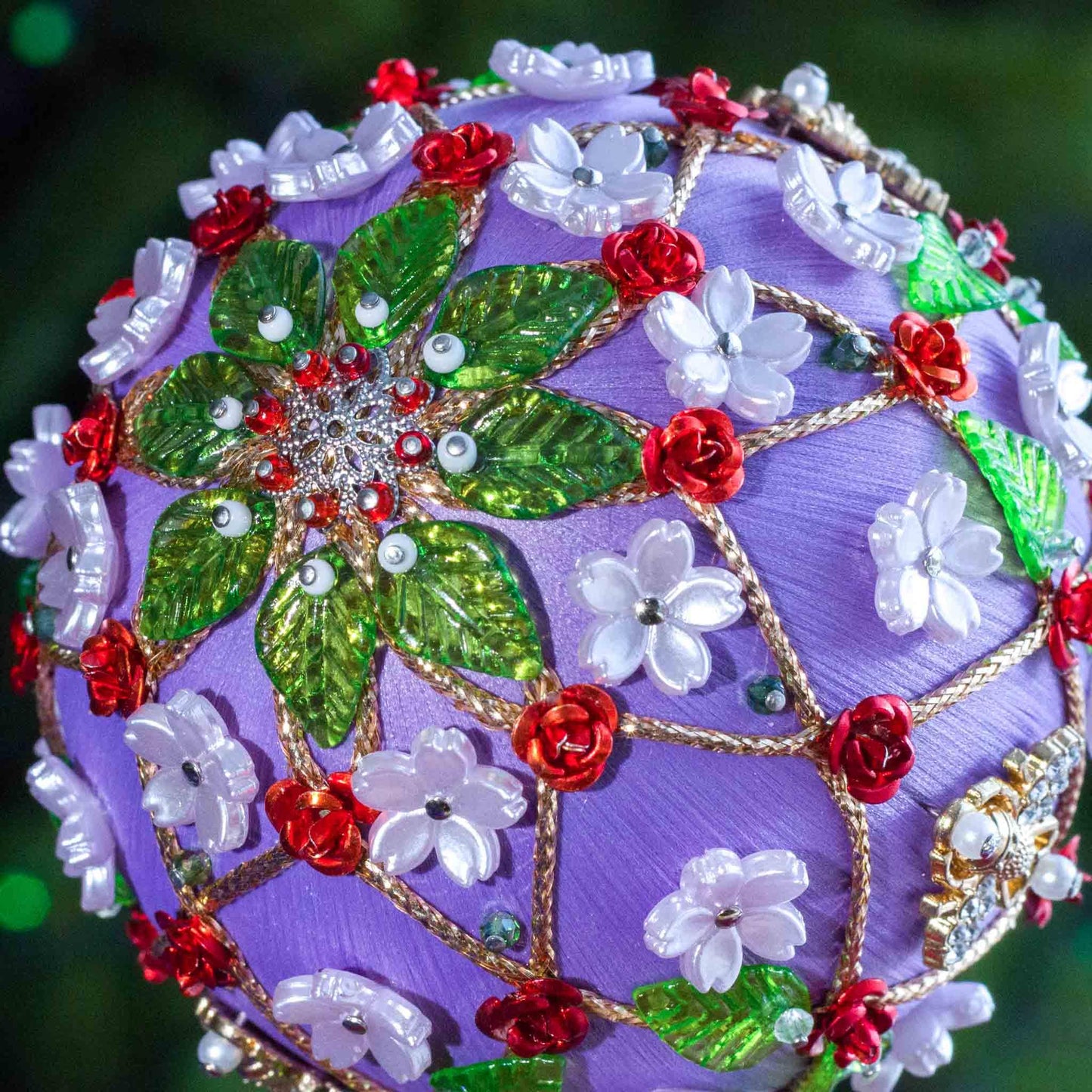 Decorative item with floral patterns on a purple background. (Medium Purple).
