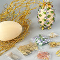 Load image into Gallery viewer, Materials to make Easter Egg Push Pin Ornament by pinning glass rhinestones chains, gold, and crystal beads to a satin ball. (Old Lace).
