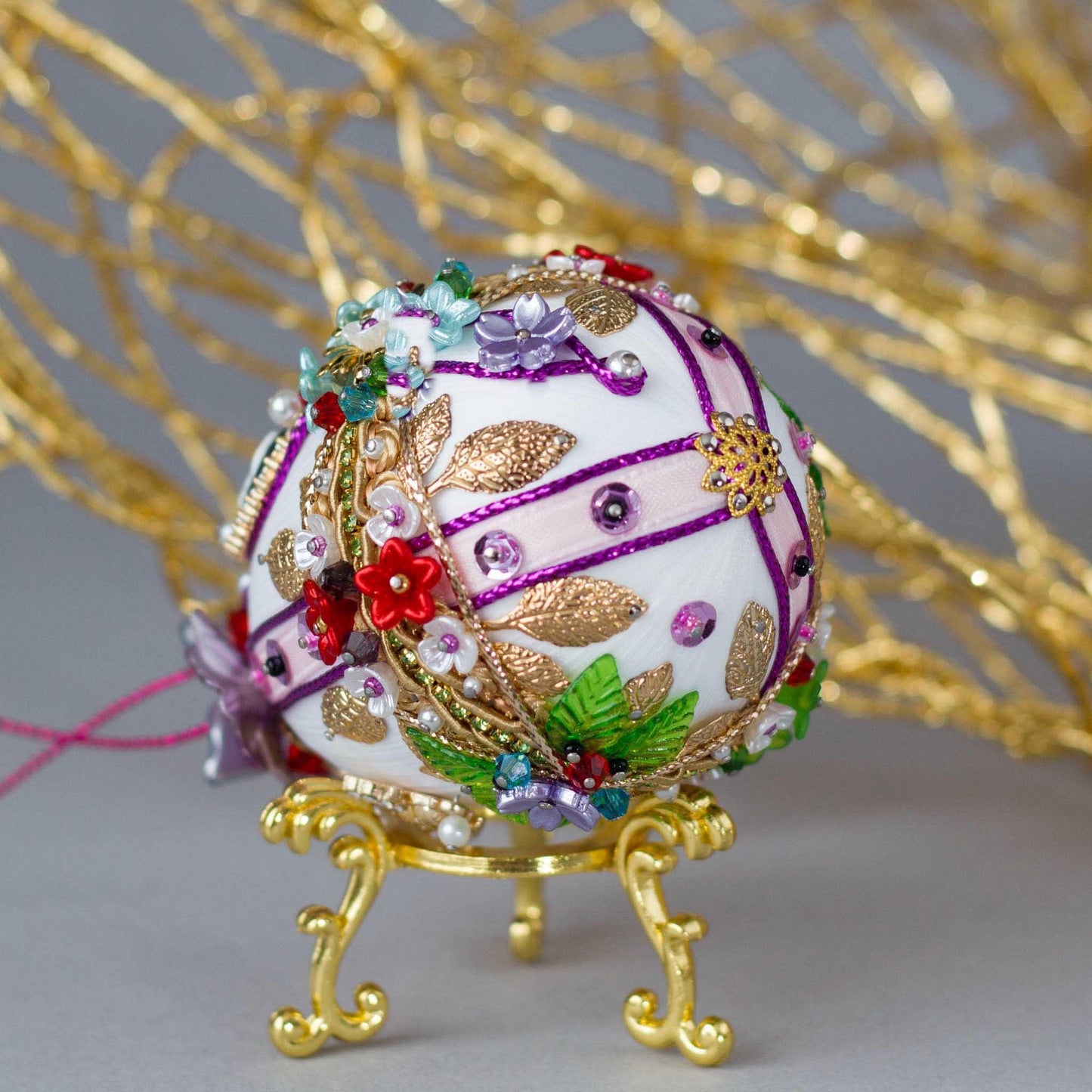 Anna Easter Egg Satin Ornament adorned with flowers, gold leaves, metallic trim, and crystal beads - Heirloom quality. (White).