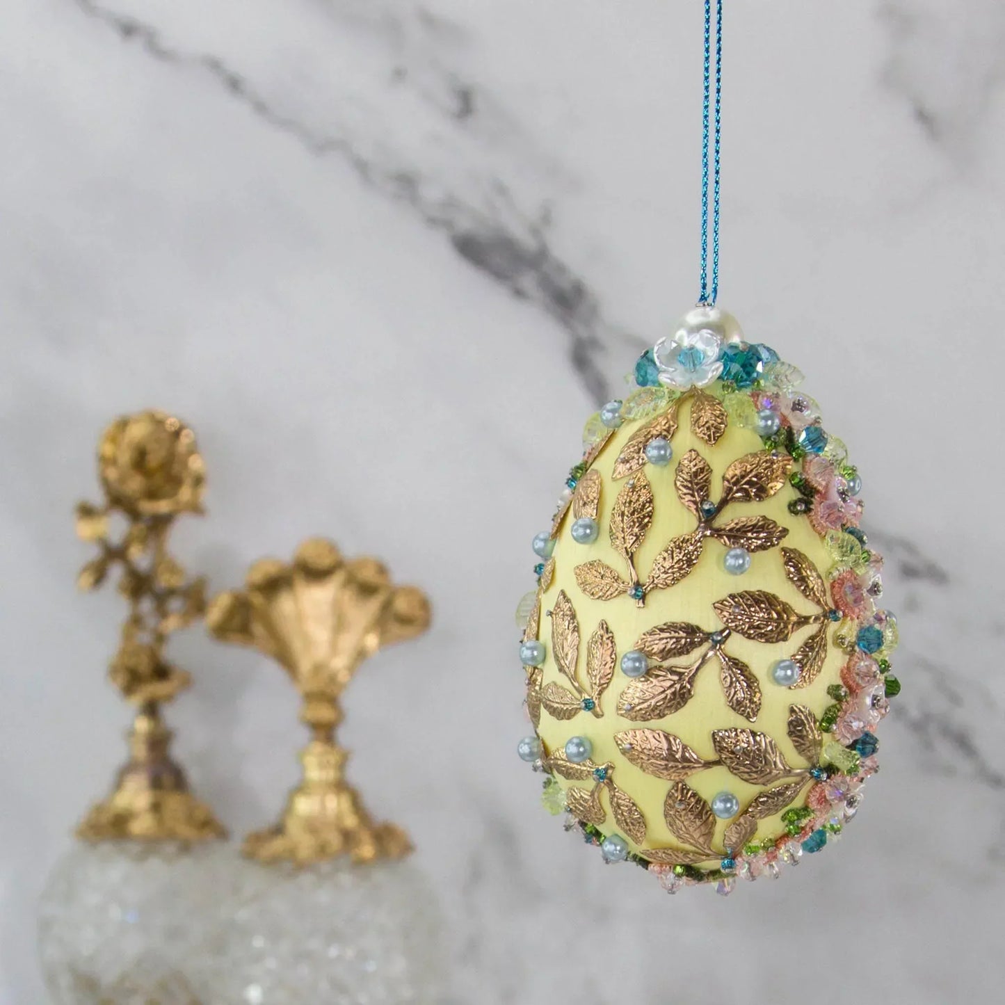 Golden Crown Easter Egg Beaded Ornament embellished with flowers, gold leaves, floral trim, and crystal beads. Back. (Light Yellow).