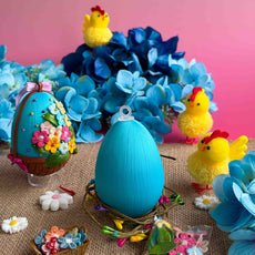 Easter egg push pin kits and chicks with flowers on a pink background. (Sky Blue)