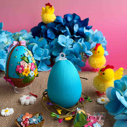 Easter egg push pin kits and chicks with flowers on a pink background. (Sky Blue)