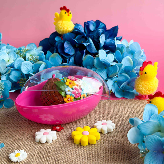 Blue push pin Easter egg  with flowers, and chicks on a pink background with blue flowers. (Sky Blue)