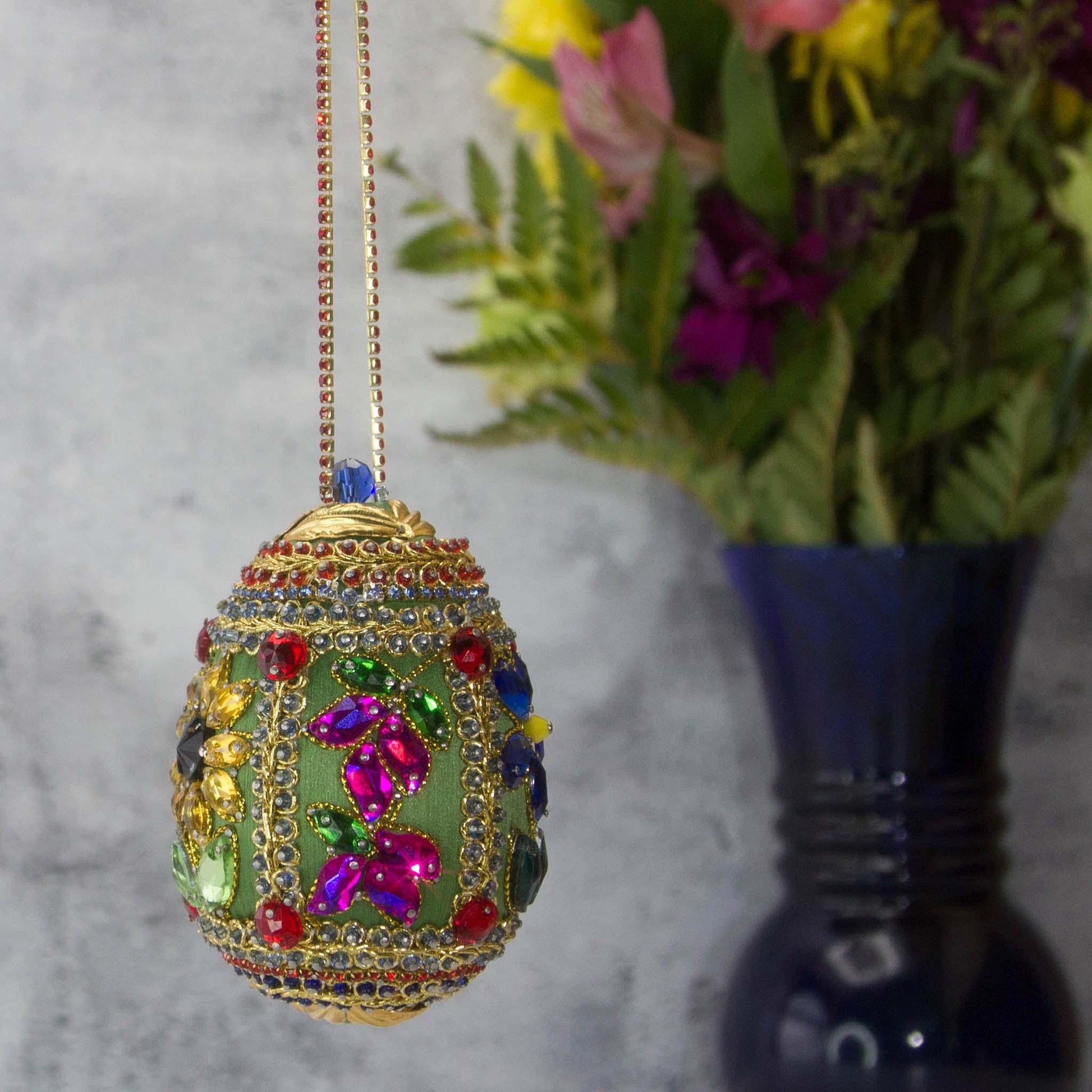 Handmade Easter Egg Beaded Ornament embellished with flowers, leaves, gold floral trim, and crystal beads. Sunflower side. (Olive).