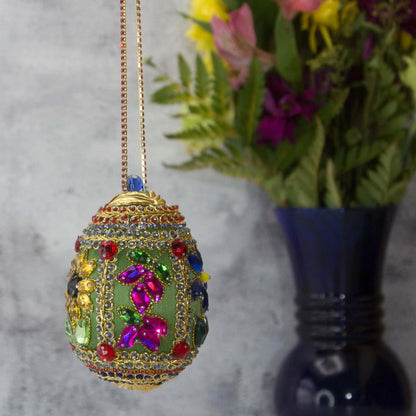 Handmade Easter Egg Beaded Ornament embellished with flowers, leaves, gold floral trim, and crystal beads. Sunflower side. (Olive).