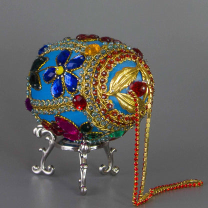 Handmade Easter Egg Beaded Ornament embellished with flowers, leaves, gold floral trim, and crystal beads. Top detail. (Sky Blue).