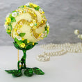 Load image into Gallery viewer, Christmas or Easter Beaded Ornament Ball embellished with flowers, trim, and beads. Handmade. Top detail. (Light Yellow).
